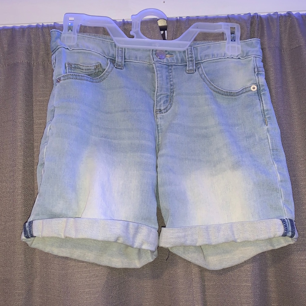 Light blue jean shorts.